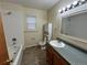 Bathroom with tiled shower/tub, vanity, and a bright mirror, offering a serene space at 2043 S Salida St, Aurora, CO 80013