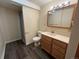 Bathroom featuring vanity sink, toilet, and glass-enclosed shower stall at 2043 S Salida St, Aurora, CO 80013