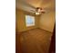 Bedroom featuring a ceiling fan, window, and neutral carpeting, ready for personal touches at 2043 S Salida St, Aurora, CO 80013