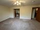 Spacious bedroom boasts carpet, ceiling fan, and a vanity area, offering comfort and functionality at 2043 S Salida St, Aurora, CO 80013
