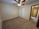 Spacious bedroom with a ceiling fan and carpeted floors, offering a comfortable retreat at 2043 S Salida St, Aurora, CO 80013