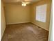 Neutral bedroom with carpet and a ceiling fan and large window at 2043 S Salida St, Aurora, CO 80013