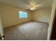 Bright bedroom featuring plush carpeting, a ceiling fan, and a window for natural light at 2043 S Salida St, Aurora, CO 80013