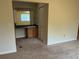 View of the bedroom vanity with updated mirror and a closet for ample storage, natural light through window at 2043 S Salida St, Aurora, CO 80013