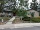 Charming single-story home featuring a brick exterior and a neatly landscaped front yard at 2043 S Salida St, Aurora, CO 80013