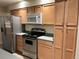 A well-maintained kitchen with stainless steel appliances and ample cabinet space at 2043 S Salida St, Aurora, CO 80013