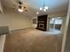 Spacious living room featuring a cozy brick fireplace and sliding glass doors to a sunroom at 2043 S Salida St, Aurora, CO 80013