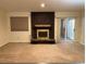Cozy living room with a brick fireplace and sliding door at 2043 S Salida St, Aurora, CO 80013