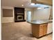 Open living area with brick fireplace and sliding glass door to the outdoor area at 2043 S Salida St, Aurora, CO 80013