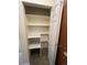 Pantry with storage shelves and tiled floor, ready for all your food storage needs at 2043 S Salida St, Aurora, CO 80013