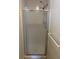 Bathroom features a modern shower stall with sliding glass doors, providing a clean and functional space at 2043 S Salida St, Aurora, CO 80013