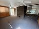 Sunroom with carpet flooring, access to the deck, and a ceiling fan at 2043 S Salida St, Aurora, CO 80013