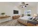 Comfortable bedroom featuring a ceiling fan, dresser and a window view at 735 S Clinton St # 5B, Denver, CO 80247