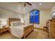 Comfortable bedroom with a large window, wooden furniture, and a neutral color scheme at 127 Marks Ln, Breckenridge, CO 80424