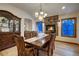 Elegant dining room features a stone fireplace and beautiful hardwood floors at 127 Marks Ln, Breckenridge, CO 80424