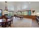 Bright game room with a pool table, fireplace, and views of the outdoors at 127 Marks Ln, Breckenridge, CO 80424