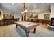 Spacious game room with a pool table, wet bar, and foosball table at 127 Marks Ln, Breckenridge, CO 80424