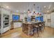 Gourmet kitchen with breakfast bar, stainless appliances, and an open view to the dining room at 127 Marks Ln, Breckenridge, CO 80424