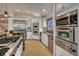 Modern kitchen with stainless steel appliances, granite countertops, and white cabinets at 127 Marks Ln, Breckenridge, CO 80424