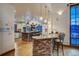 Open kitchen features stone breakfast bar, stainless steel appliances, and lots of natural light at 127 Marks Ln, Breckenridge, CO 80424