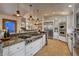 Spacious kitchen featuring an oversized gas range, stone accents, modern appliances, and ample counter space at 127 Marks Ln, Breckenridge, CO 80424