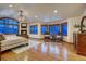 Serene main bedroom with a fireplace, sitting area, and large windows at 127 Marks Ln, Breckenridge, CO 80424