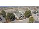 Aerial view of townhomes showcasing rooflines, landscaping, and surrounding community at 9431 Crossland Way, Highlands Ranch, CO 80130