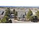 Aerial view of townhomes, showcasing rooflines, landscaping, and surrounding community at 9431 Crossland Way, Highlands Ranch, CO 80130