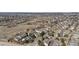Wide aerial view of a townhome community with green spaces and walking paths at 9431 Crossland Way, Highlands Ranch, CO 80130