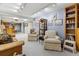 Basement featuring carpet, furniture, and a bar in the background at 9431 Crossland Way, Highlands Ranch, CO 80130