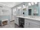 Bright bathroom featuring double sinks, vanity, and walk-in shower at 9431 Crossland Way, Highlands Ranch, CO 80130
