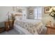 Comfortable bedroom with a bed, side tables and a quilt at 9431 Crossland Way, Highlands Ranch, CO 80130