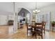 Open floor plan showing dining and living areas; lots of light and hardwood floors at 9431 Crossland Way, Highlands Ranch, CO 80130