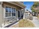 A charming covered entrance with stone accents and a bench, perfect for enjoying the outdoors at 9431 Crossland Way, Highlands Ranch, CO 80130