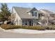 Charming two-story home with beautiful landscaping, front porch, and well-maintained lawn at 9431 Crossland Way, Highlands Ranch, CO 80130