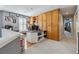 Spacious home office area with built-in wooden cabinetry and desk at 9431 Crossland Way, Highlands Ranch, CO 80130