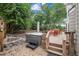 Backyard features a hot tub, stone patio and deck with outdoor seating at 20304 Vista Cir, Parker, CO 80138