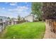 Spacious fenced backyard with mature tree for shade, perfect for recreation at 20304 Vista Cir, Parker, CO 80138