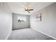 Neutral bedroom with a ceiling fan and a bright window offers versatile space for personalization and comfort at 20304 Vista Cir, Parker, CO 80138