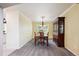 Elegant dining room featuring a wood table and chairs, decorative lighting, and a built-in cabinet at 20304 Vista Cir, Parker, CO 80138