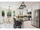 Bright kitchen with granite countertops, stainless steel appliances, and an adjacent breakfast nook at 20304 Vista Cir, Parker, CO 80138