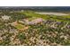 Expansive aerial view showcasing a community with schools, lush parks, and peaceful lake at 9650 W 35Th Ave, Wheat Ridge, CO 80033