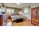 Cozy bedroom featuring hardwood floors, natural light, and neutral colors at 9650 W 35Th Ave, Wheat Ridge, CO 80033