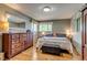 Inviting bedroom featuring hardwood floors, natural light, and neutral colors at 9650 W 35Th Ave, Wheat Ridge, CO 80033
