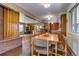 Open-concept dining area flows into the kitchen, creating an inviting space for gatherings and entertaining at 9650 W 35Th Ave, Wheat Ridge, CO 80033