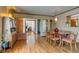 Elegant dining area with hardwood floors, stylish lighting, and seamless flow into the adjacent living spaces at 9650 W 35Th Ave, Wheat Ridge, CO 80033