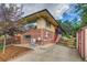 Brick home featuring a well-maintained yard, concrete patio, and convenient side-entry access at 9650 W 35Th Ave, Wheat Ridge, CO 80033