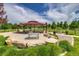 Community picnic pavilion features shaded seating, rock landscaping, and manicured lawns at 9650 W 35Th Ave, Wheat Ridge, CO 80033