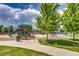 Fun playground featuring colorful structures, lush green trees and plenty of space at 9650 W 35Th Ave, Wheat Ridge, CO 80033