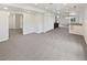 Open basement includes neutral walls and carpets, closet and bar area at 23559 Branston Ln, Parker, CO 80138